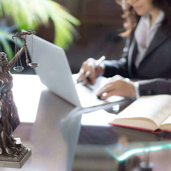 female lawyer on laptop in office